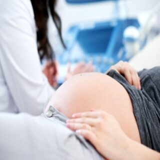 doctor-performing-ultrasound-scanning-her-pregnant-patient (2) doctor-performing-ultrasound-scanning-her-pregnant-patient (2)