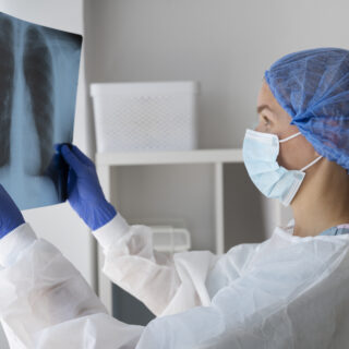 side-view-doctor-checking-radiography side-view-doctor-checking-radiography